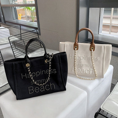 Bolsa de praia em lona com alça de couro e detalhes de pérolas, estilo tote único, com alça de ombro