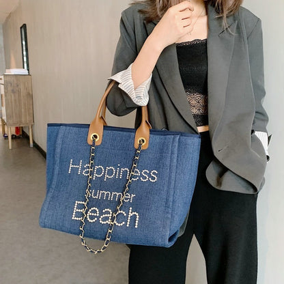 Bolsa de praia em lona com alça de couro e detalhes de pérolas, estilo tote único, com alça de ombro